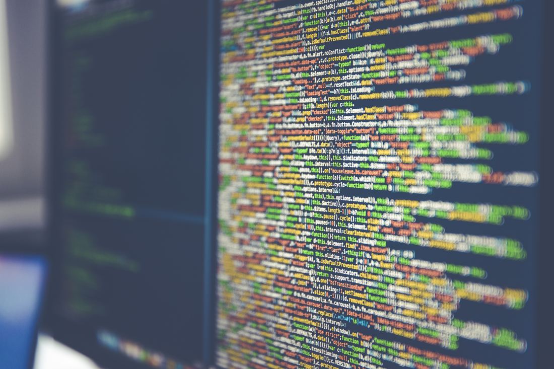 Lines of colorful code on a computer monitor